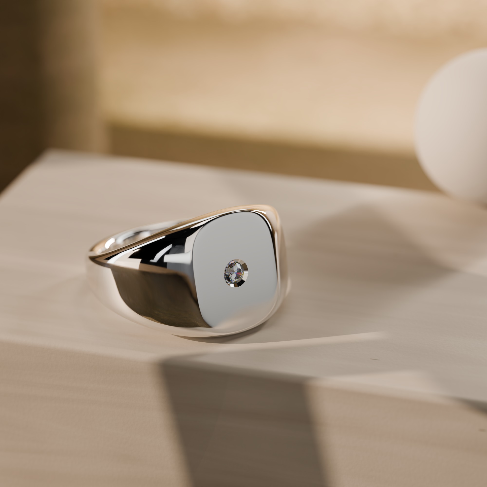 Polished sterling silver signet ring on stone