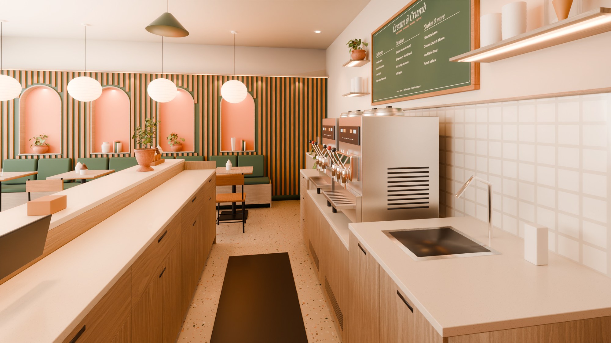 Staff-side view along the service aisle between the front counter and the back counter with the machines and hand-wash basin