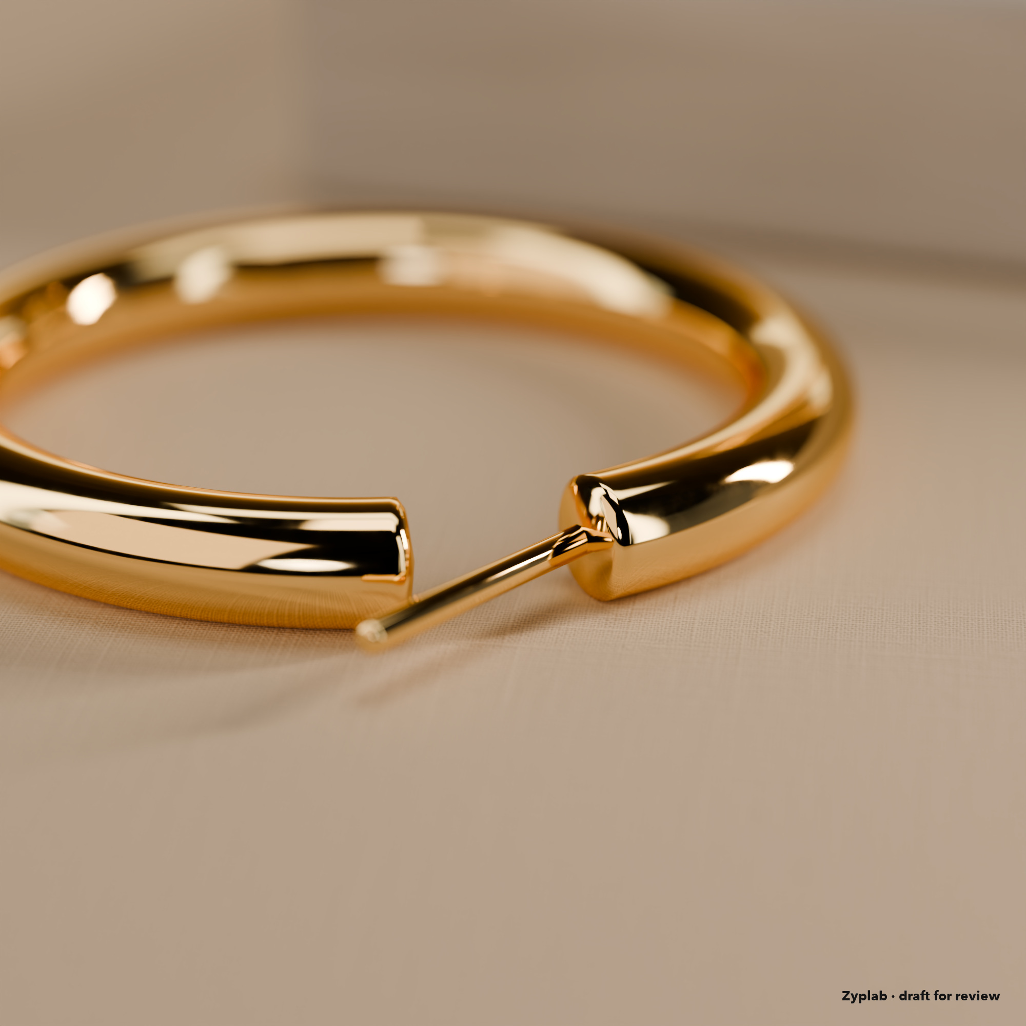 Close-up of a gold hoop earring latch